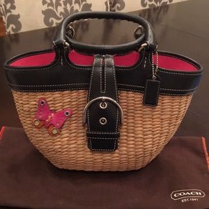 Rare COACH leather trim woven straw tote.